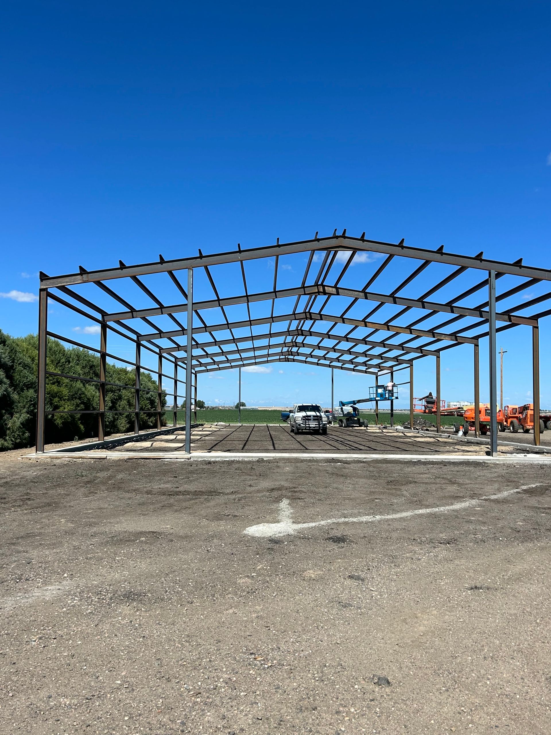 A large metal structure with a blue sky in the background