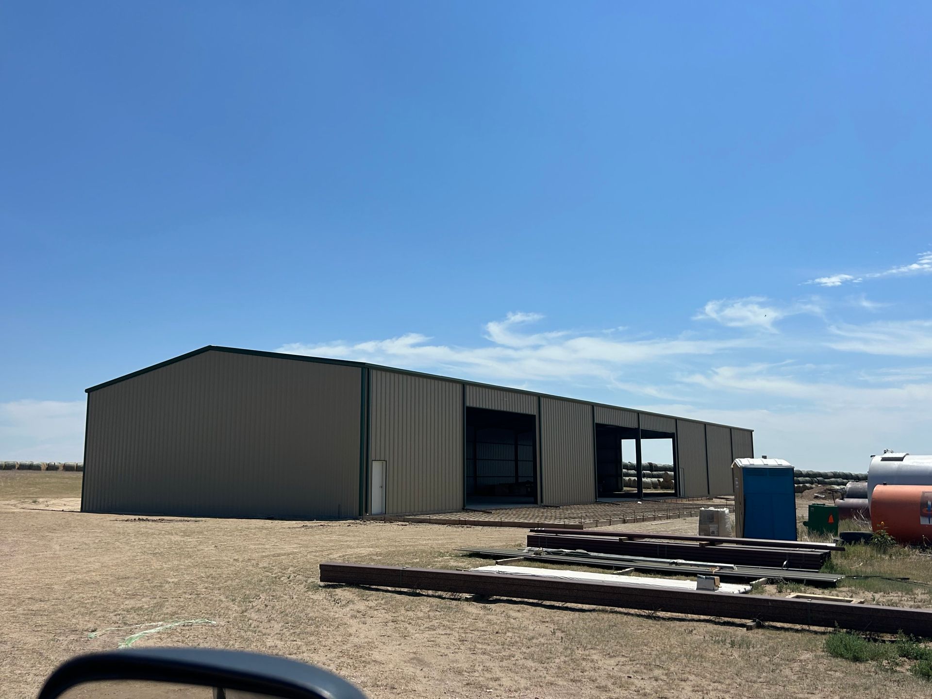 A large building with a blue sky in the background