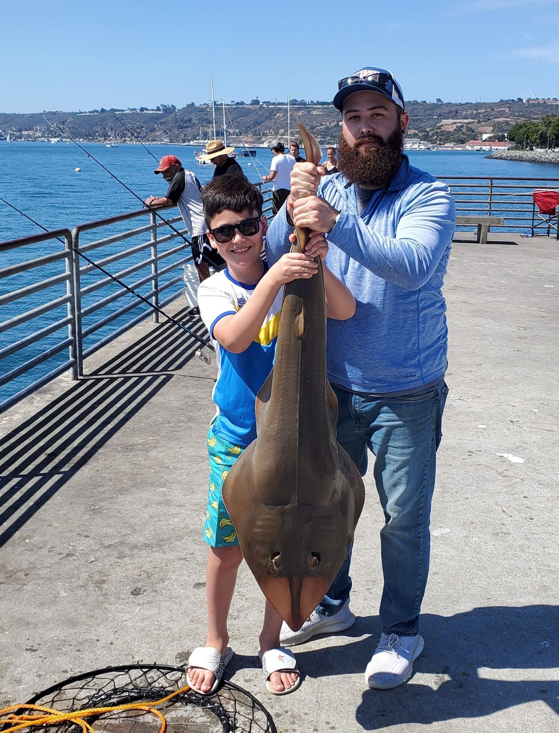 Father and Son Caught a Fish — San Diego, CA — SoCal Eco Tours Father and Son Caught a Fish — San Diego, CA — SoCal Eco Tours