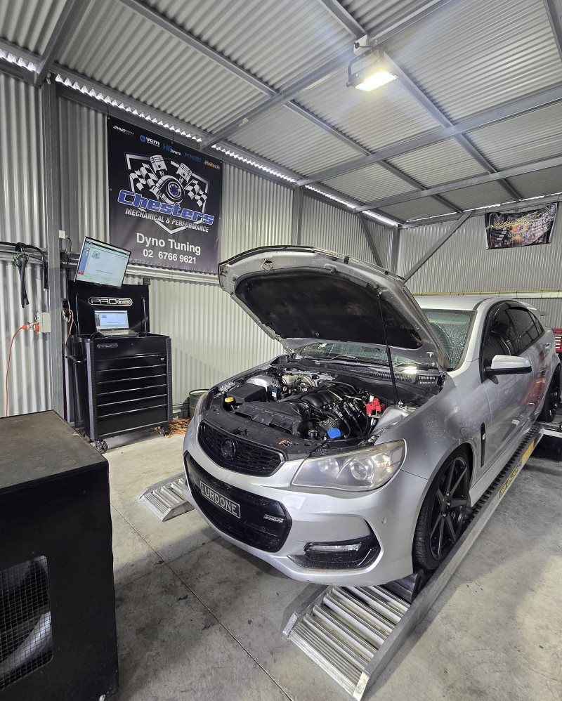 Silver Car With Hood Open on a Dyno in a Garage — Mechanic in Tamworth, NSW