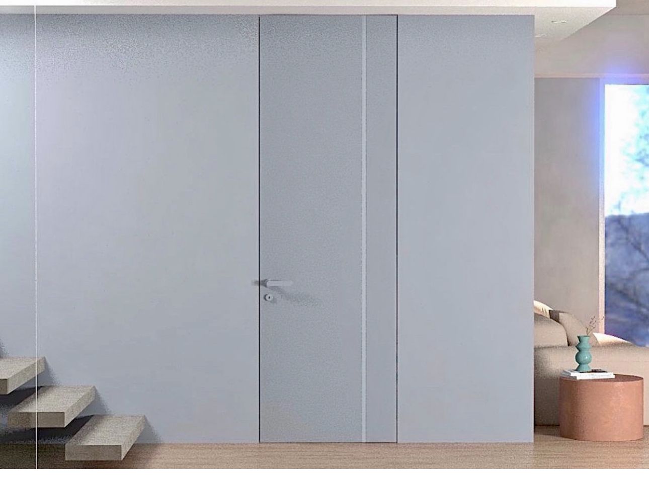 En stue med en trapp, en sofa, et bord og en dør.