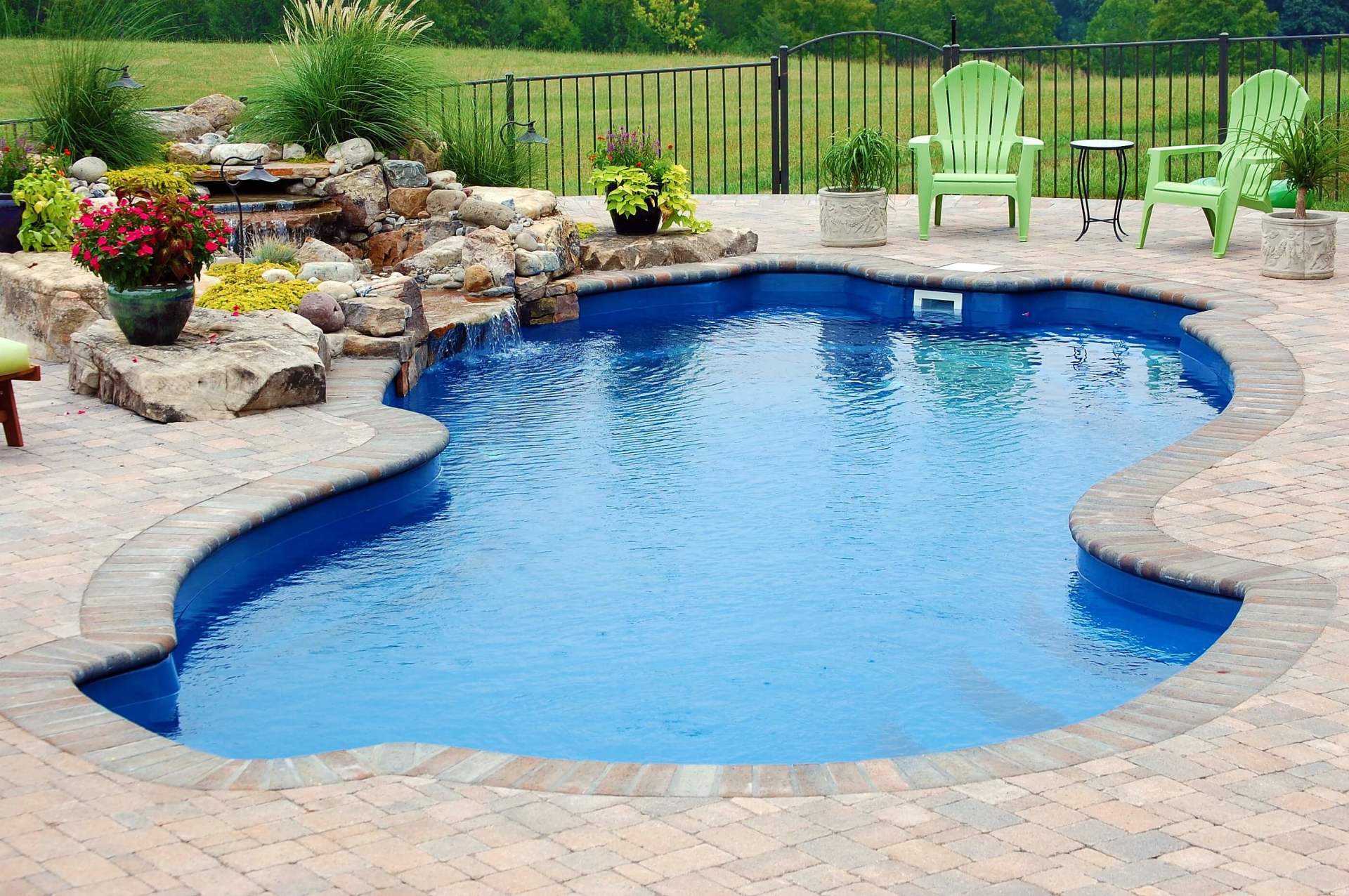 Fiberglass Pool With Chairs On The Side — Staunton, VA — Valley Pool & Spa
