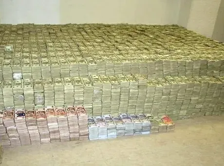 A large pile of money is stacked on top of each other.