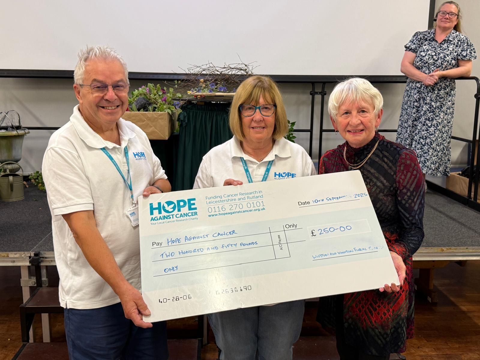 A cheque presentation from the Wigston and Knighton Floral Society