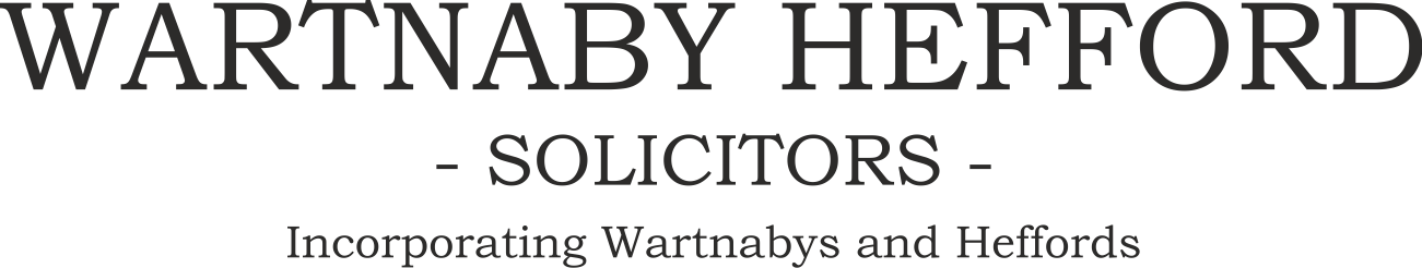 A black and white logo for wartnaby hefford solicitors