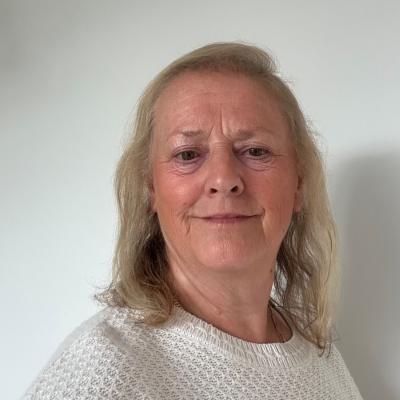 Photo of Hope Volunteer Ambassador Gill Merrill smiling into the camera