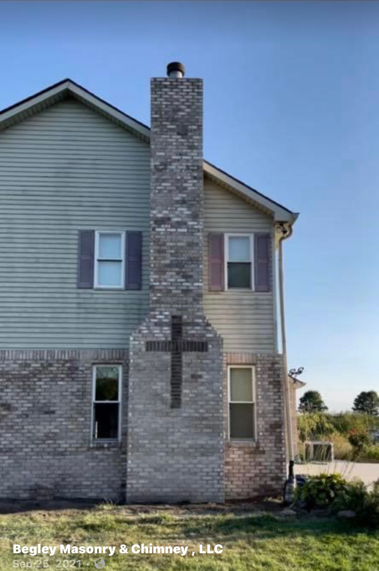A house with a cross on the side of it.