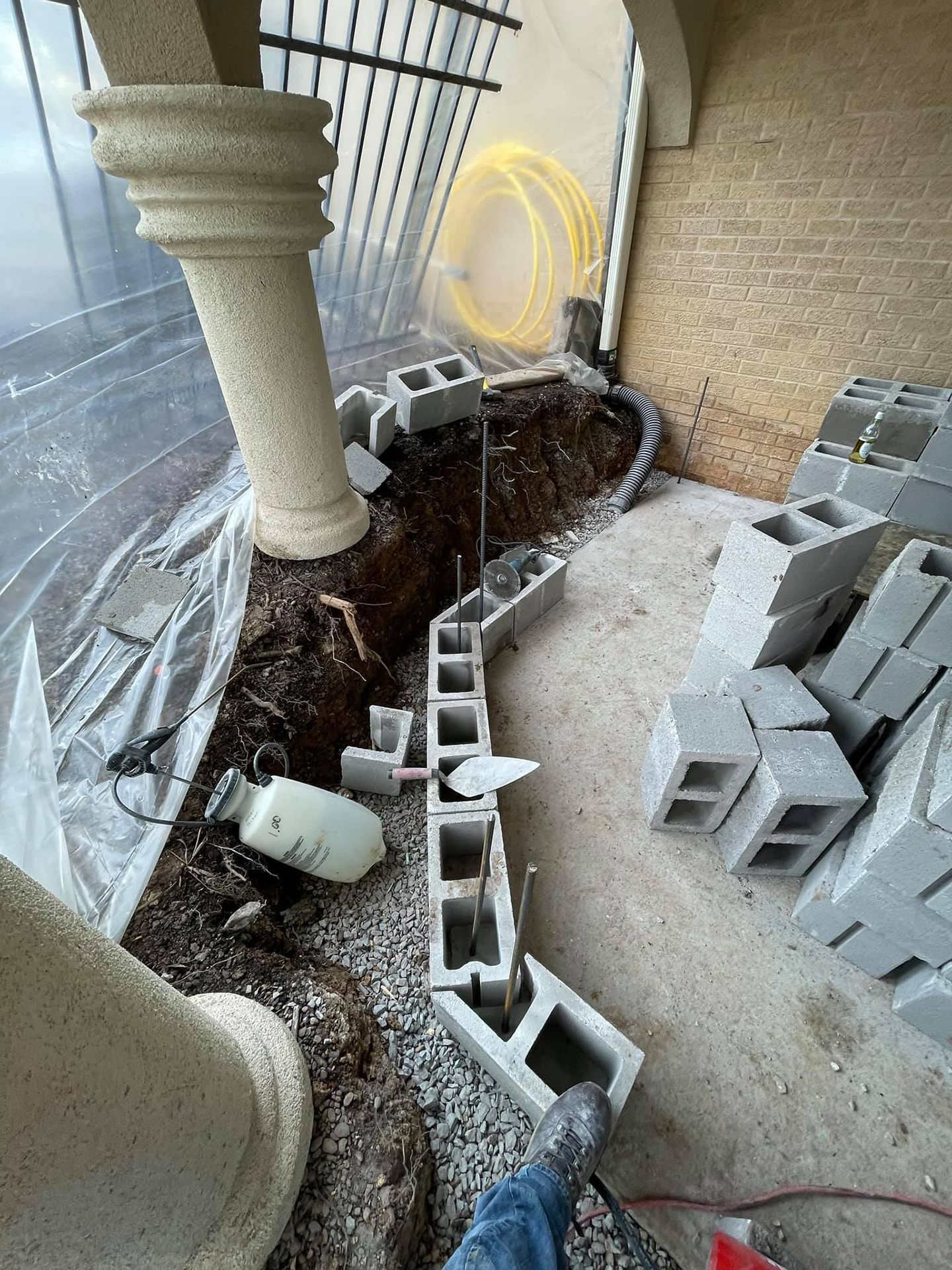 A bunch of concrete blocks are laying on the ground in a room.