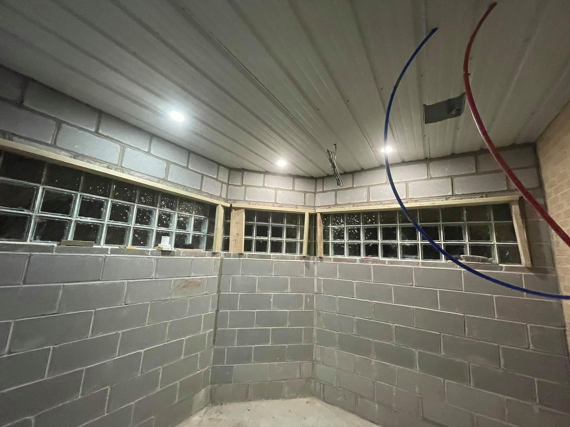 A room with brick walls and a white ceiling