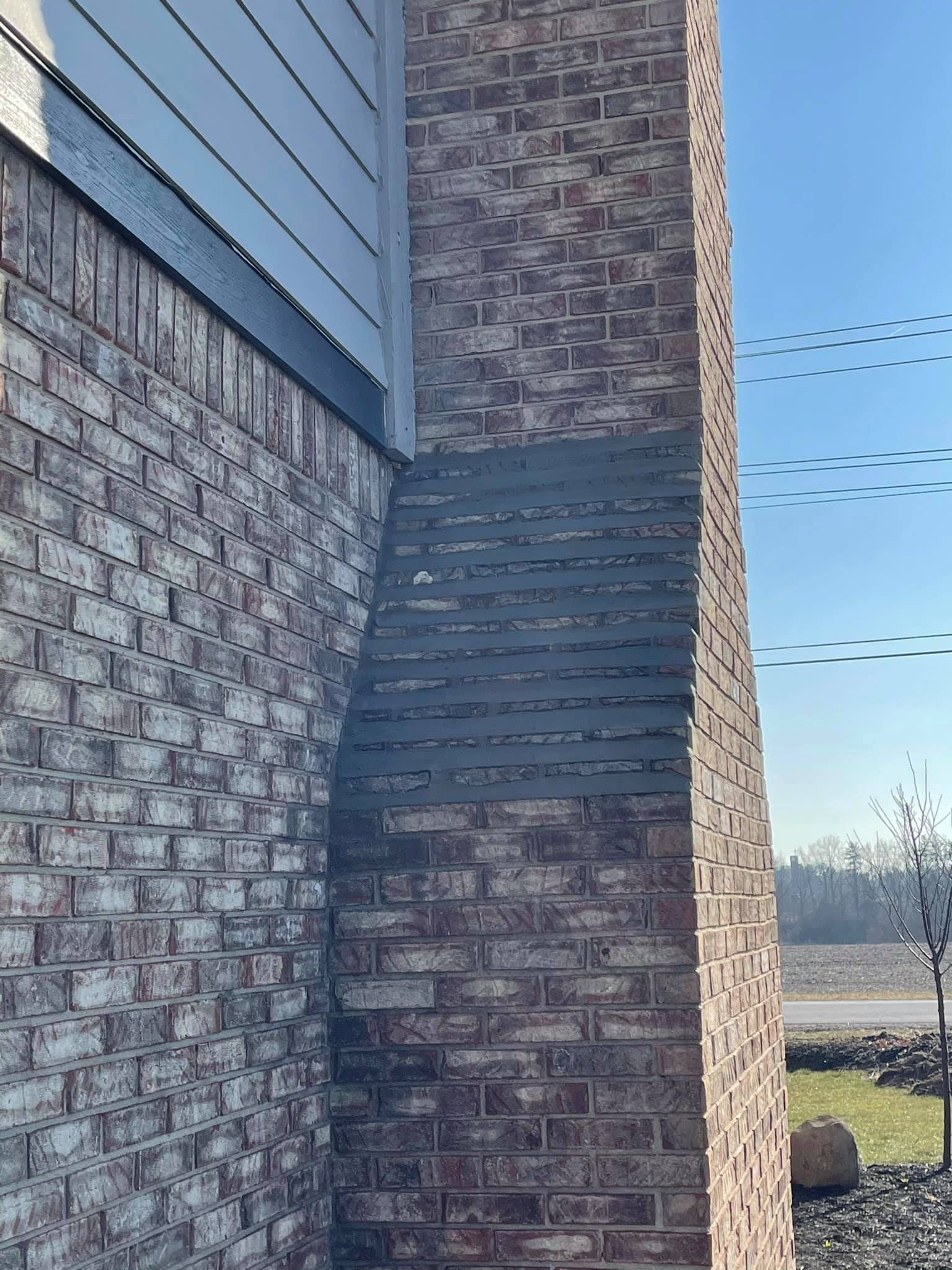 A brick building with a chimney on the side of it.