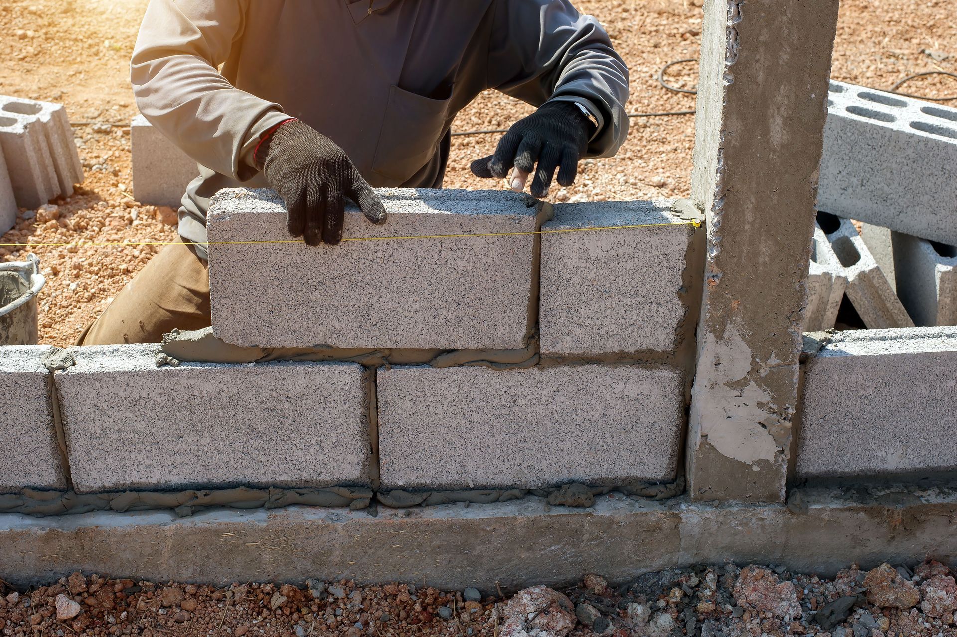 Man is Laying Bricks on a Wall