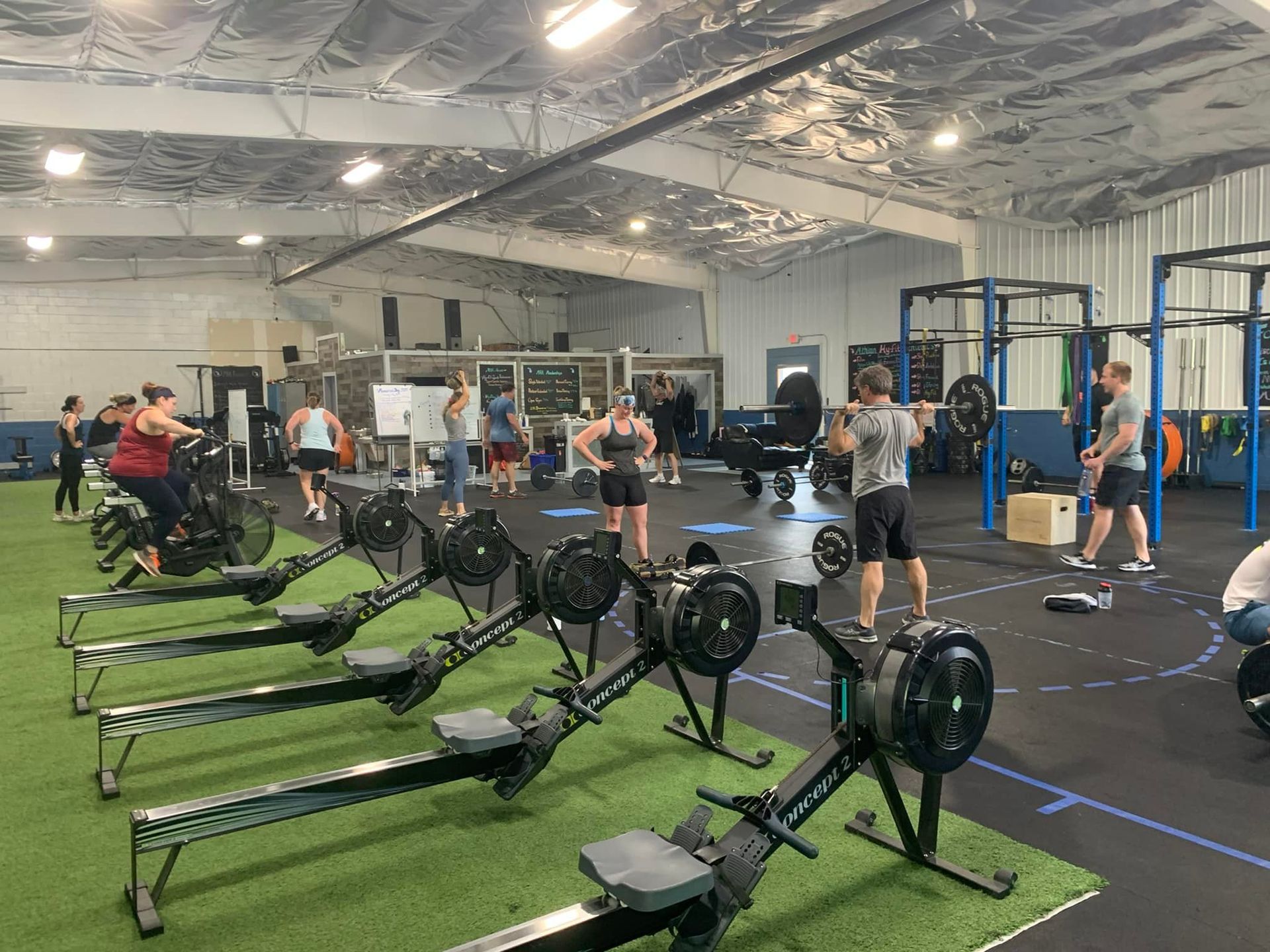 A group of people are working out in a gym.