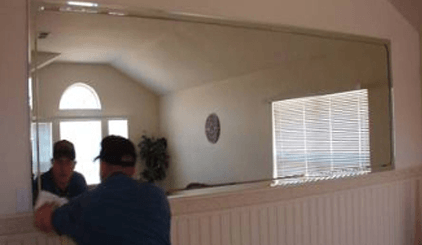 Worker Installing A Mirror Glass — Belleville, IL — Glass & More Inc.