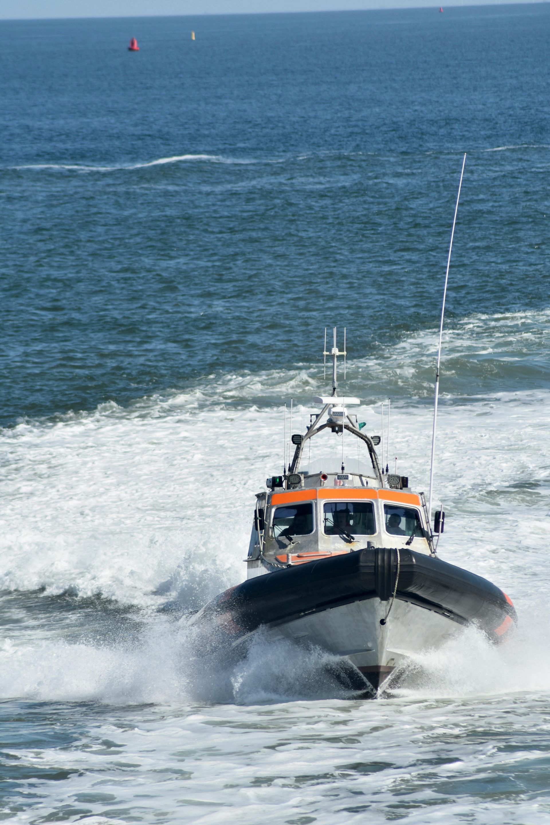A boat is floating on top of a body of water