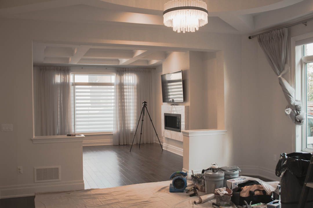 a person is laying on the floor in a living room .