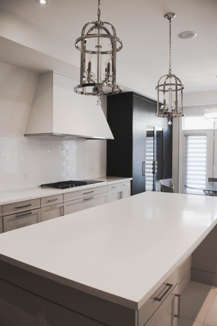 a kitchen with a large island and a stove top oven .