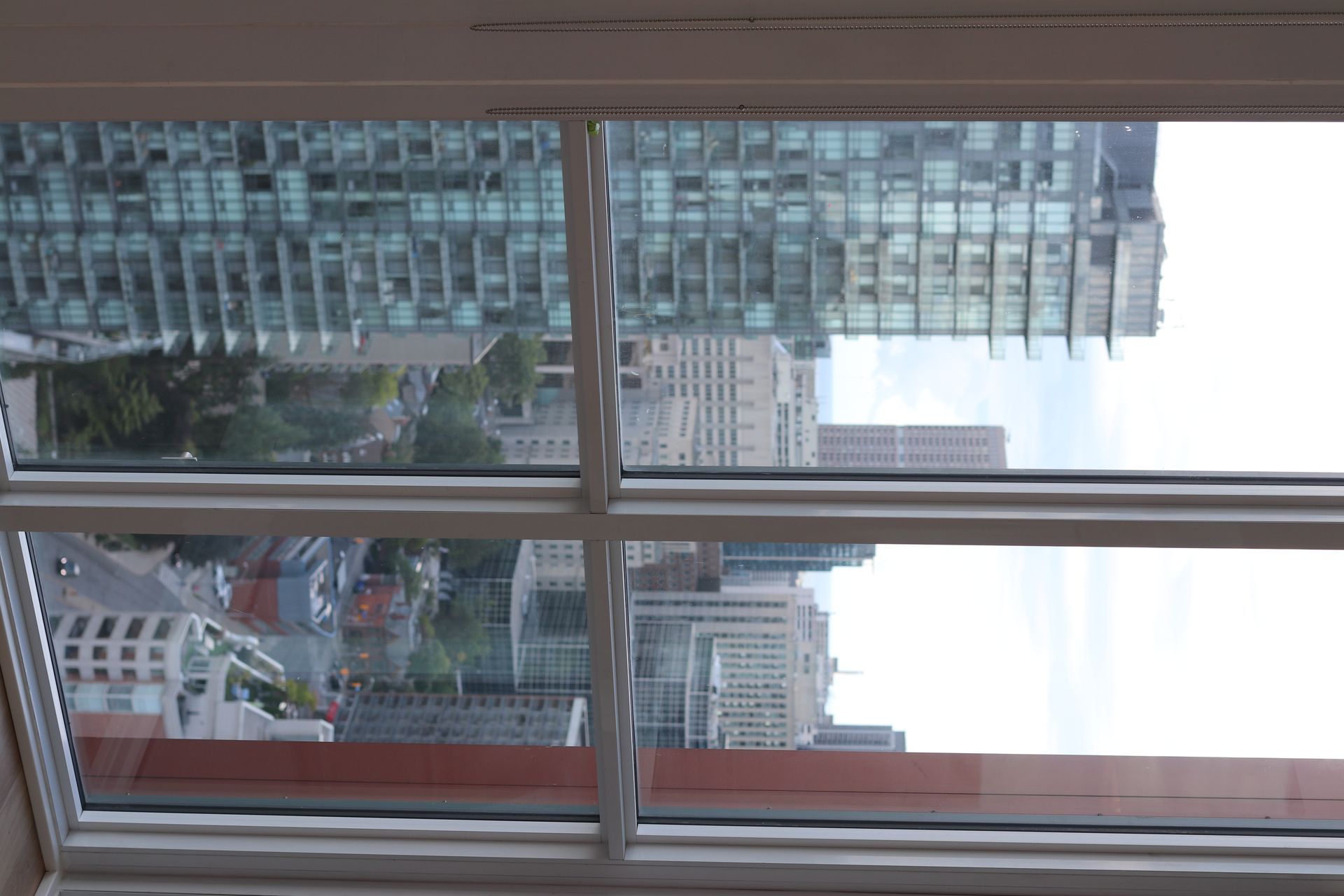 a large window with a view of a city skyline .