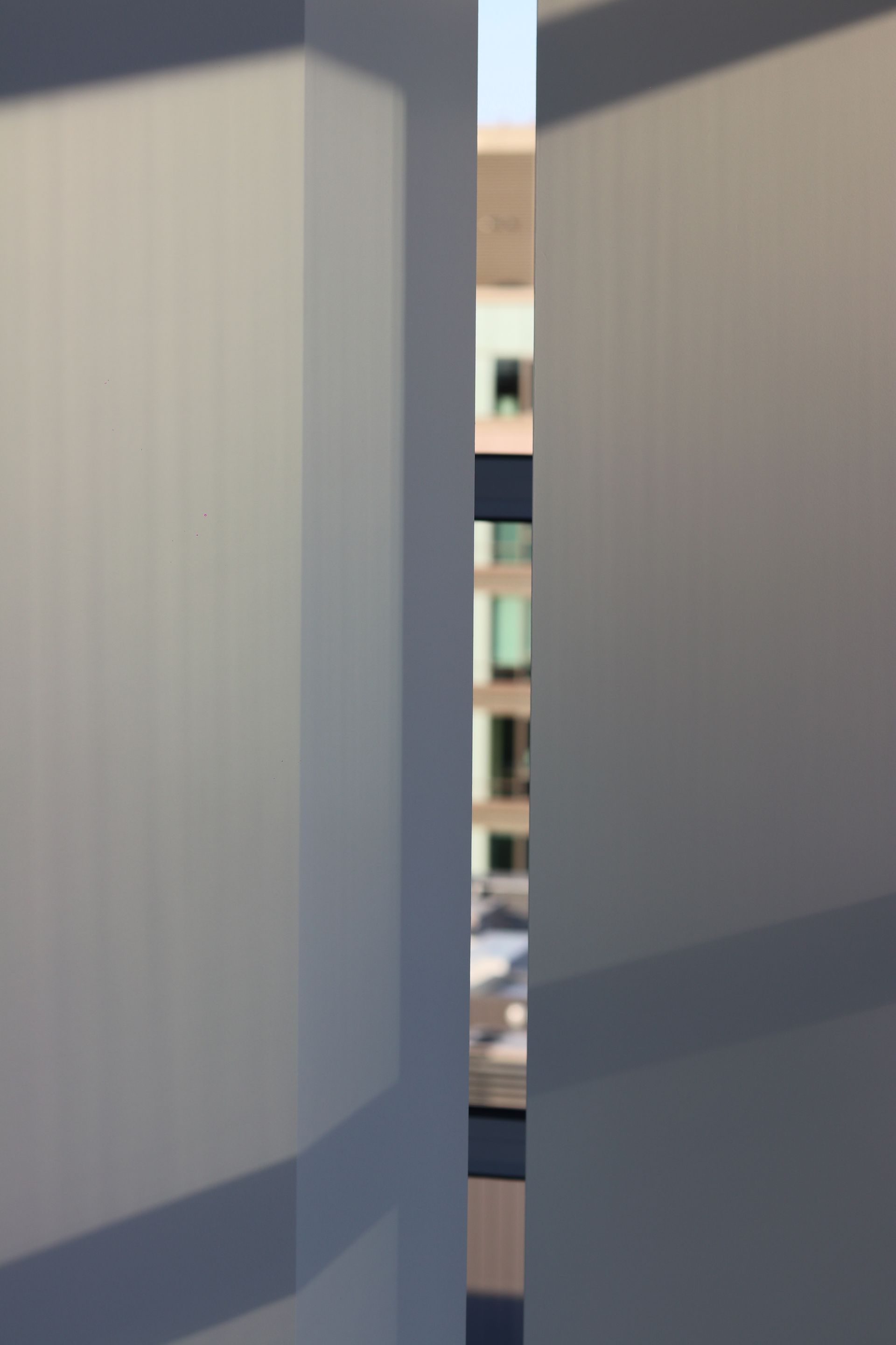 a blurry picture of a building behind a glass wall