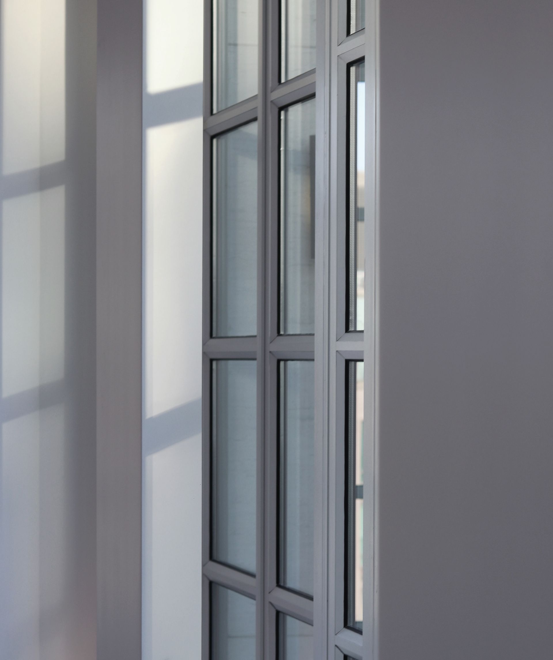 a close up of a door with a lot of windows in a room .