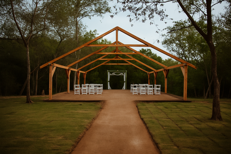 A bride and groom are getting married under a wooden structure in the woods.