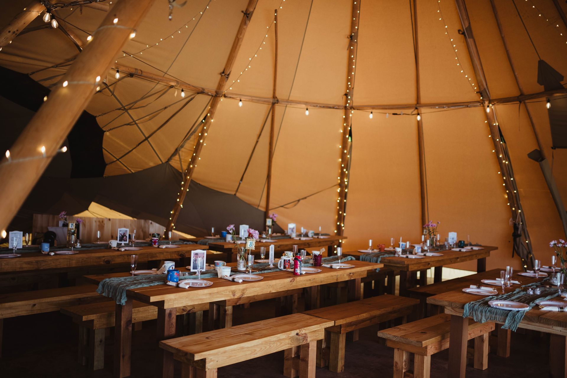 Elegant tipi setup for outdoor wedding reception