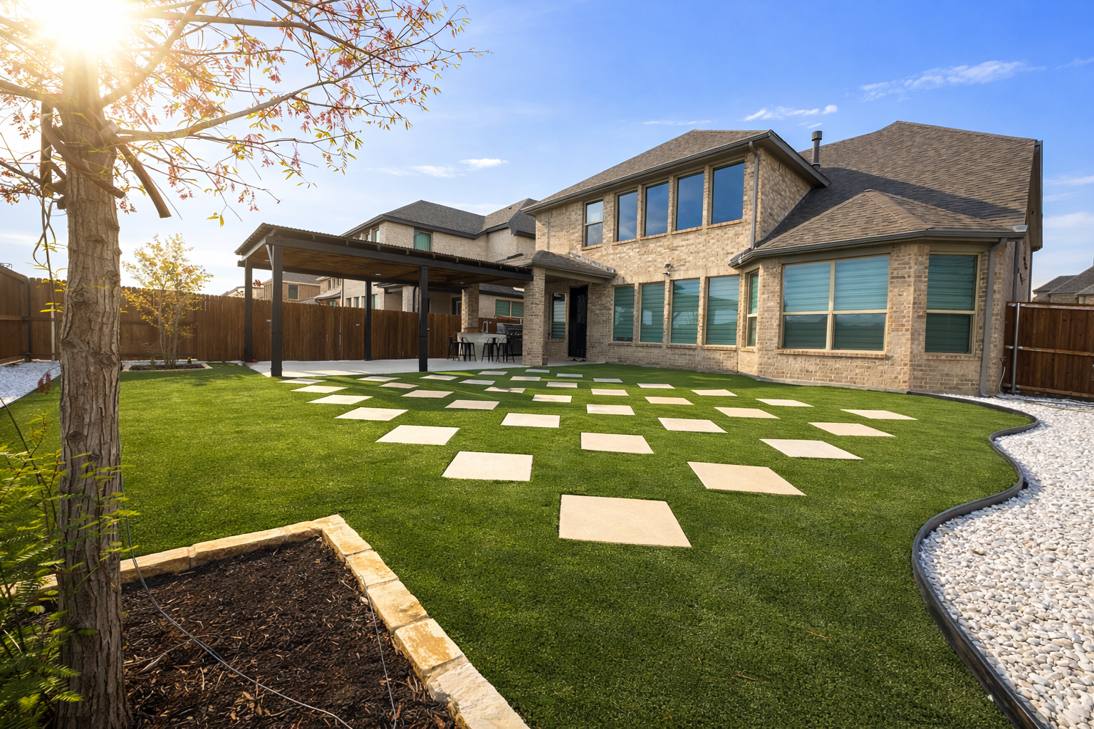 Green lawn with white square stepping stones, brown fence, and clear sky. Green lawn with white square stepping stones, brown fence, and clear sky.