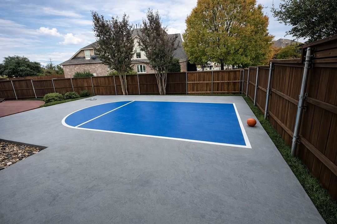 Green lawn with manicured bushes and trees in front of a brick house under a blue sky. Green lawn with manicured bushes and trees in front of a brick house under a blue sky.