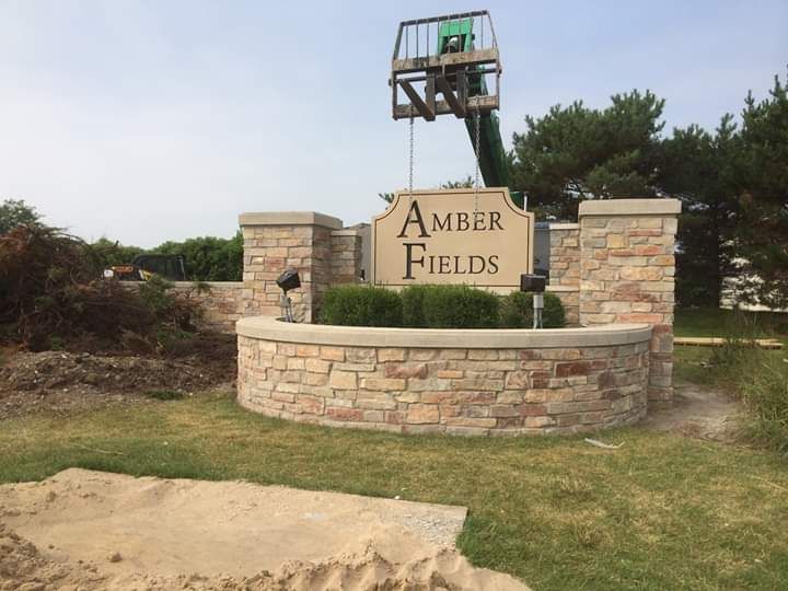 A sign that says amber fields on it