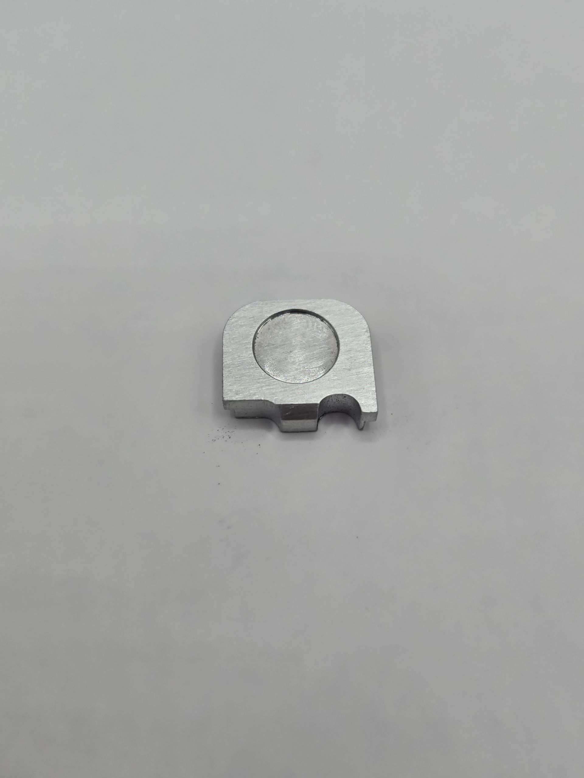 Silver rectangular plate with two notches.