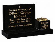 Oliver George memorial in gold letters