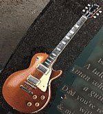 guitar engraved on a memorial stone