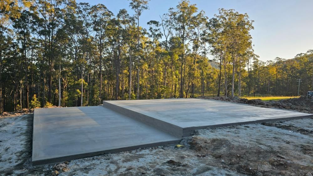 A Large Concrete Slab is in the Middle of a Forest — MidCoast Concreting in Mount George, NSW