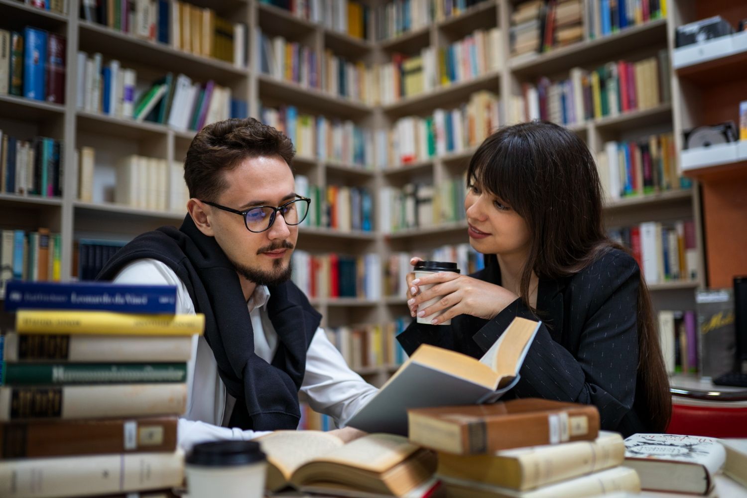 Family walking on a beach, smiling. Sunshine, ocean in background.