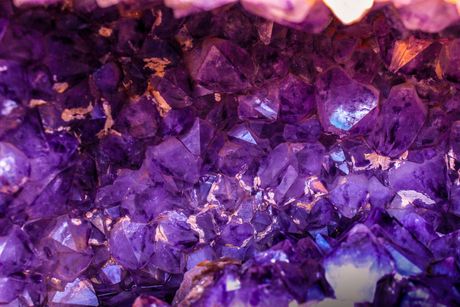A close up of a pile of purple crystals.