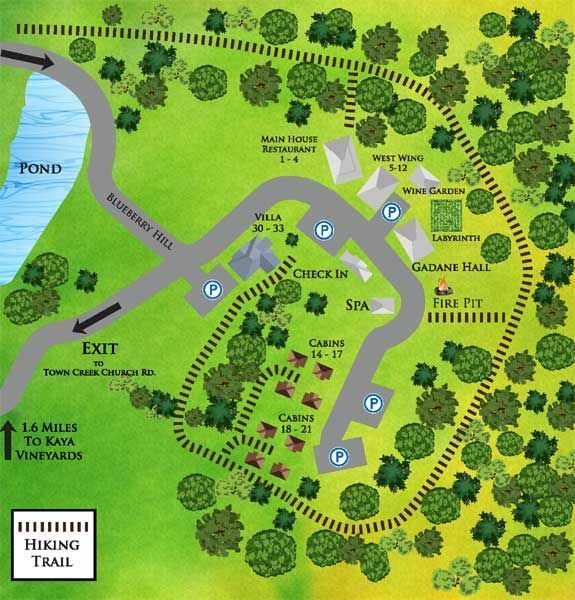 A map of a hiking trail with a pond in the background