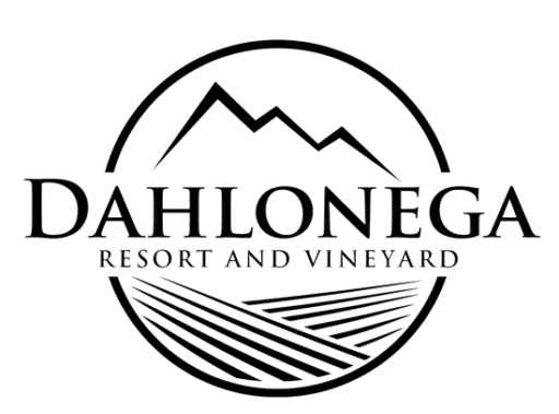 A logo for kaya vineyard and winery with a mountain in the background