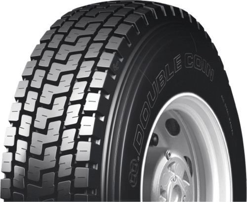 A white semi truck is parked on the side of the road.