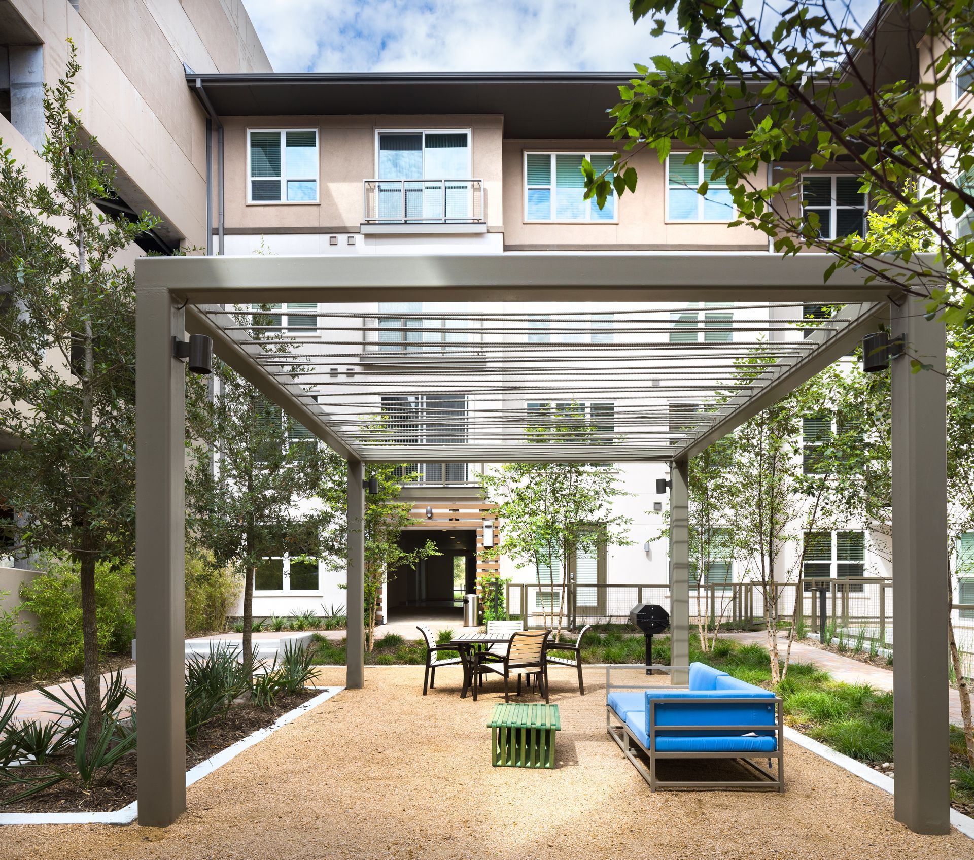 Parkside at Craig Ranch apartment building with a pergola in front of it