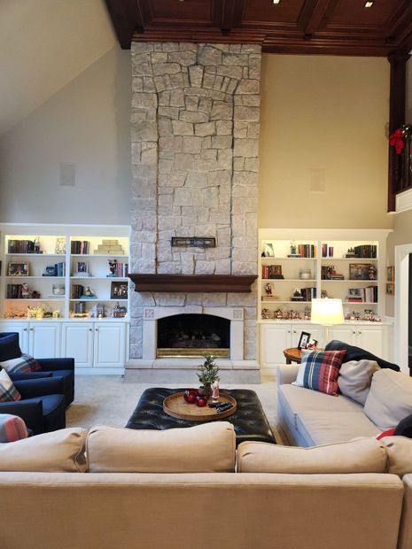 A living room with a fireplace and a couch
