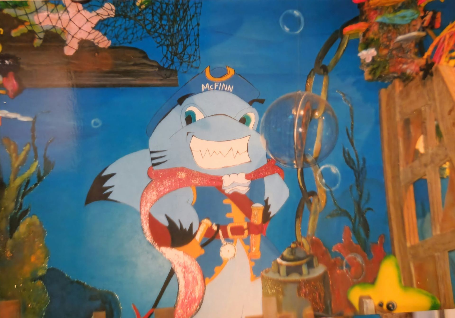A painting of a shark wearing a pirate hat and scarf artist kids room