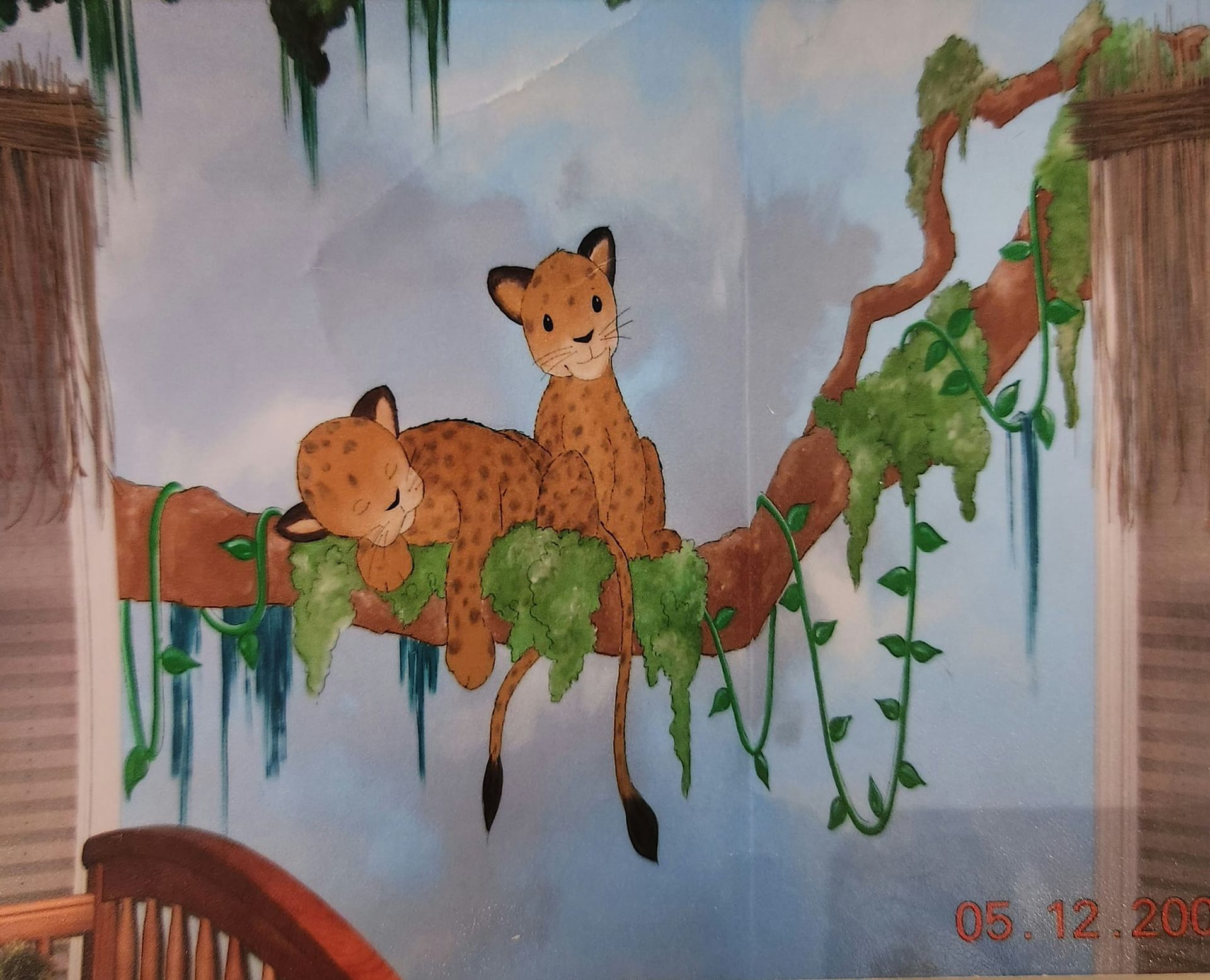 A painting of two cheetah cubs laying on a tree branch artist kids room