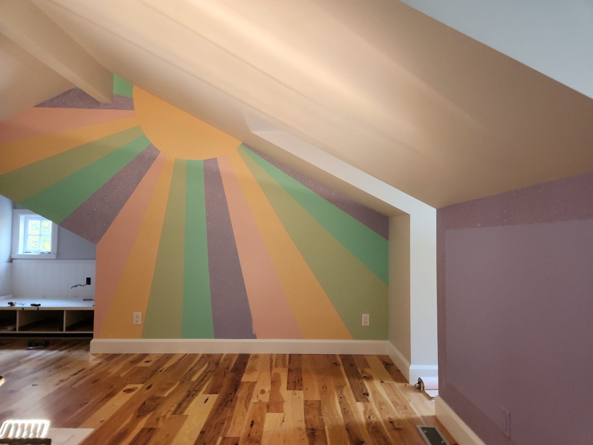 A room with a vaulted ceiling and a painting on the wall artist teen room