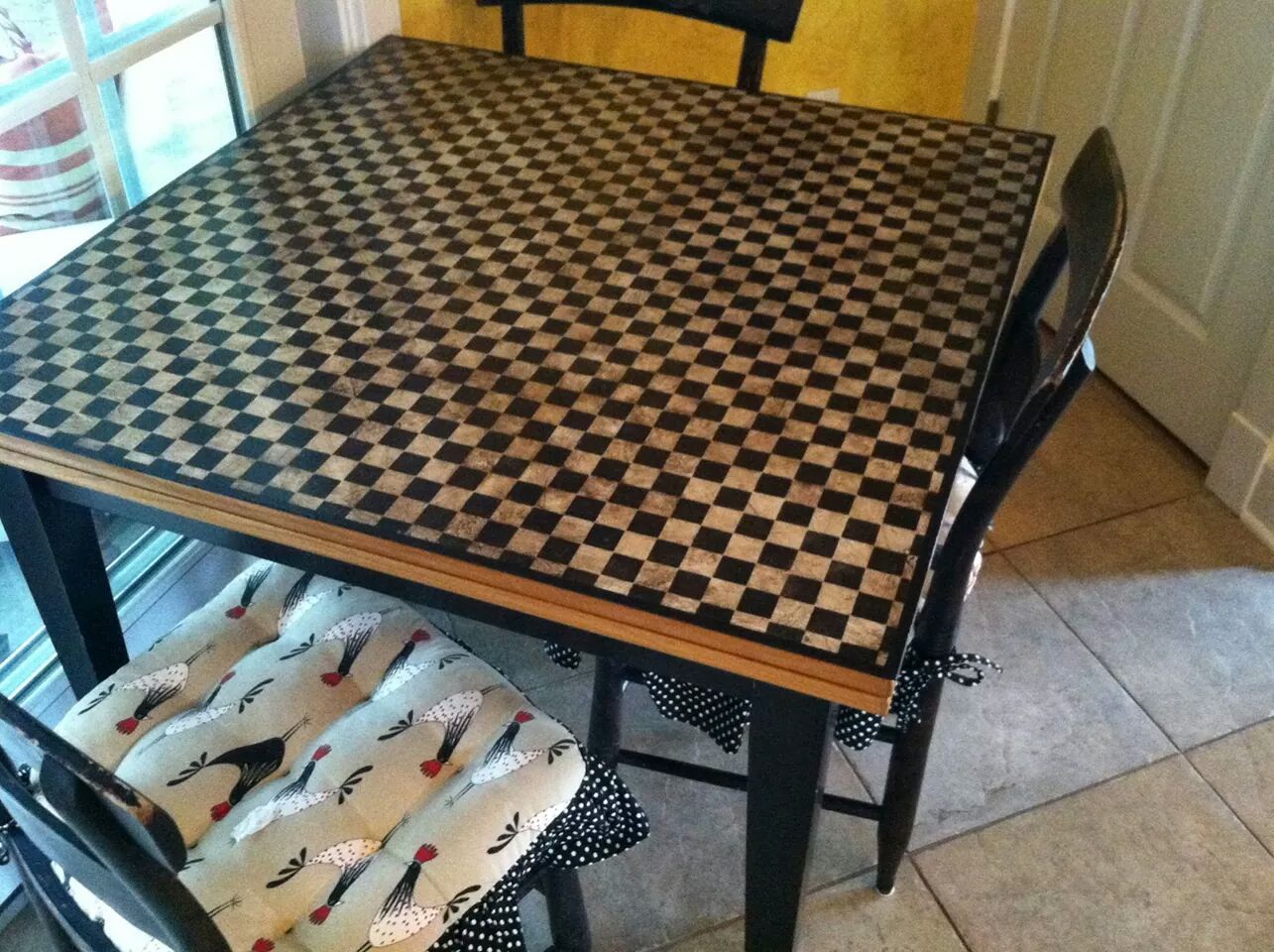 A black and white checkered table with two chairs