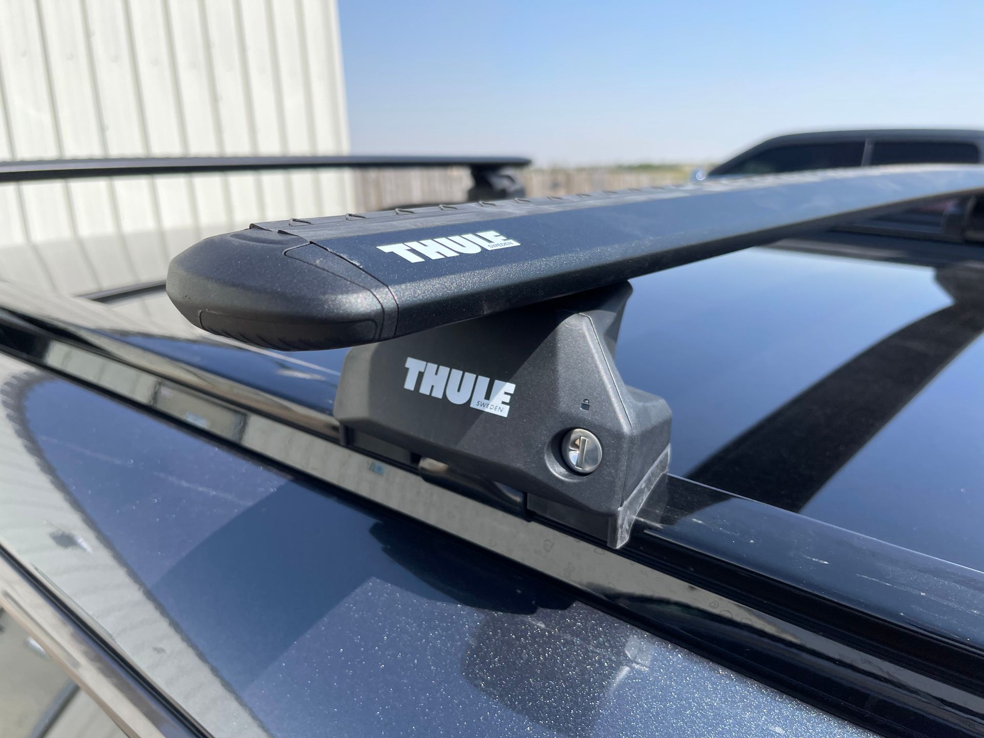 a close up of a thule roof rack on a car