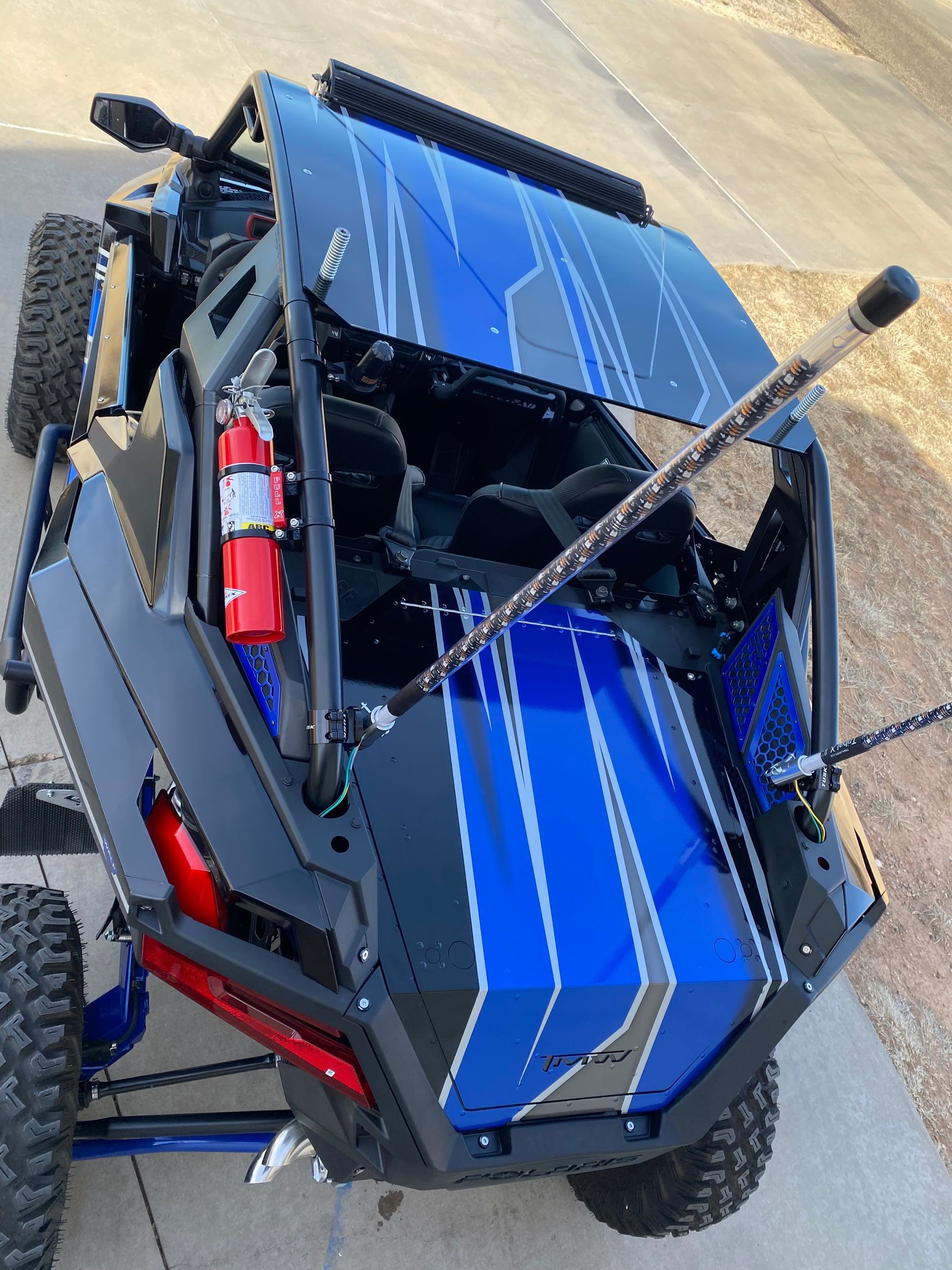 a thule roof rack is attached to the roof of a car .