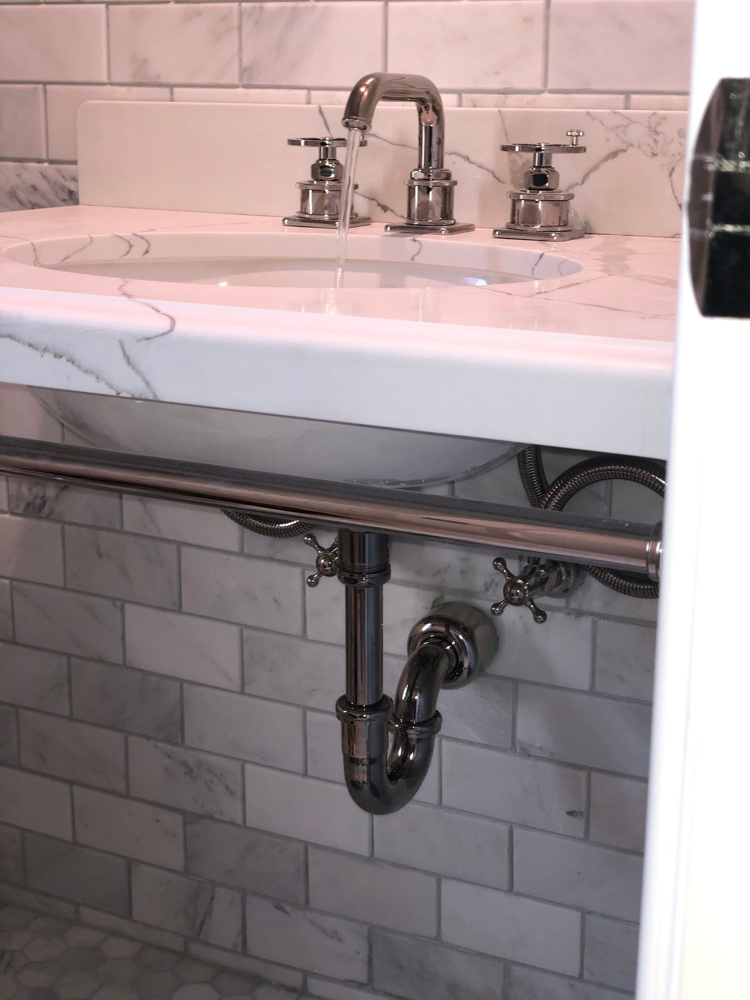 A bathroom sink with two sinks and a faucet