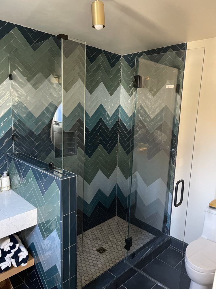 A bathroom with a walk in shower and a toilet