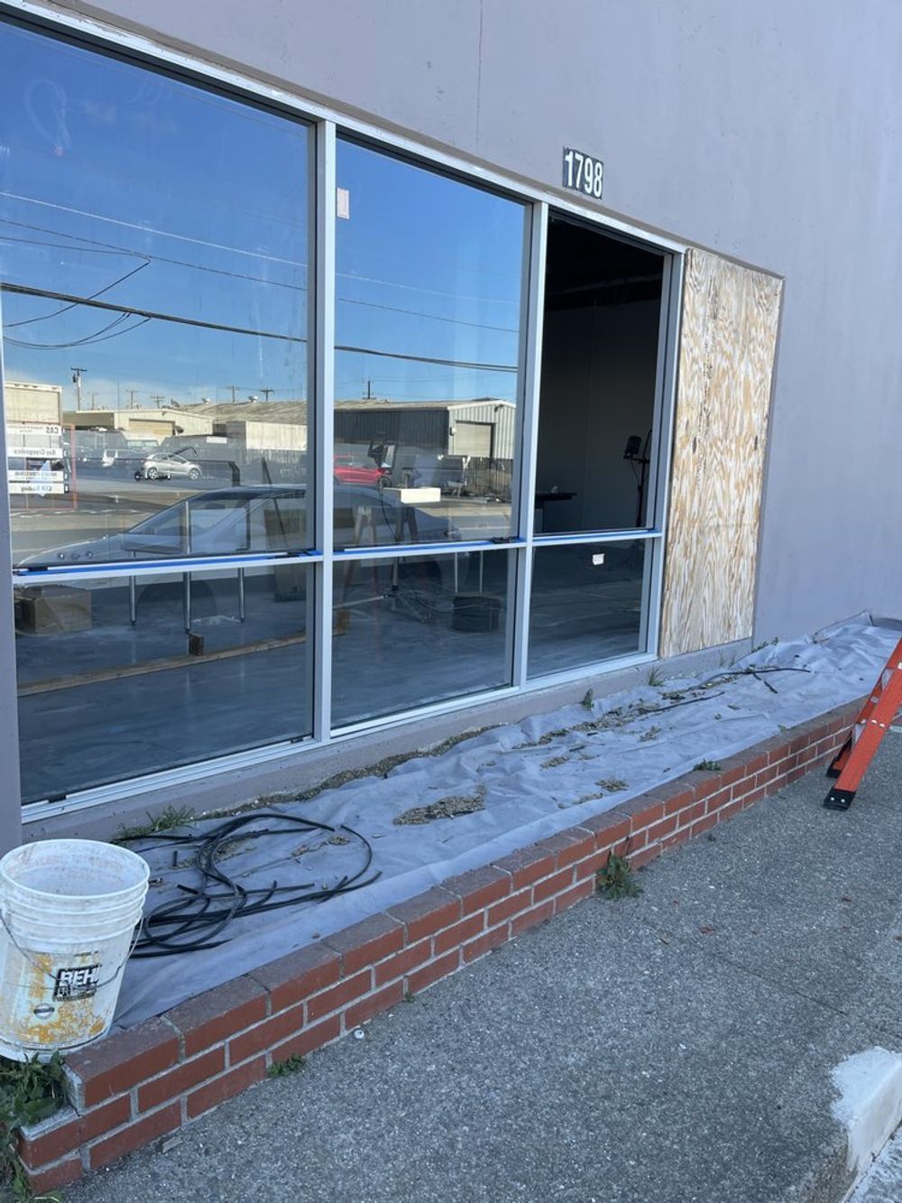 A building with a lot of windows is being remodeled.