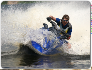 A man is riding a jet ski in the water