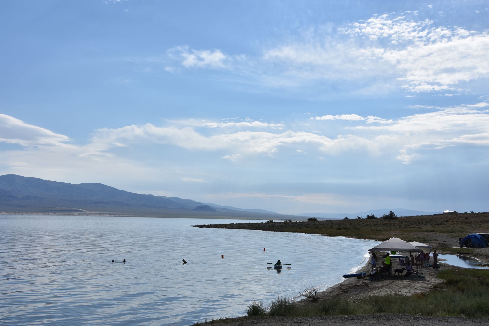 A large body of water with mountains in the background.